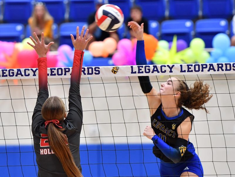 Legacy's Lucy Blair hits the ball over the net during a game against Holliday on Tuesday, Sep. 2, 2025 at Legacy High School.