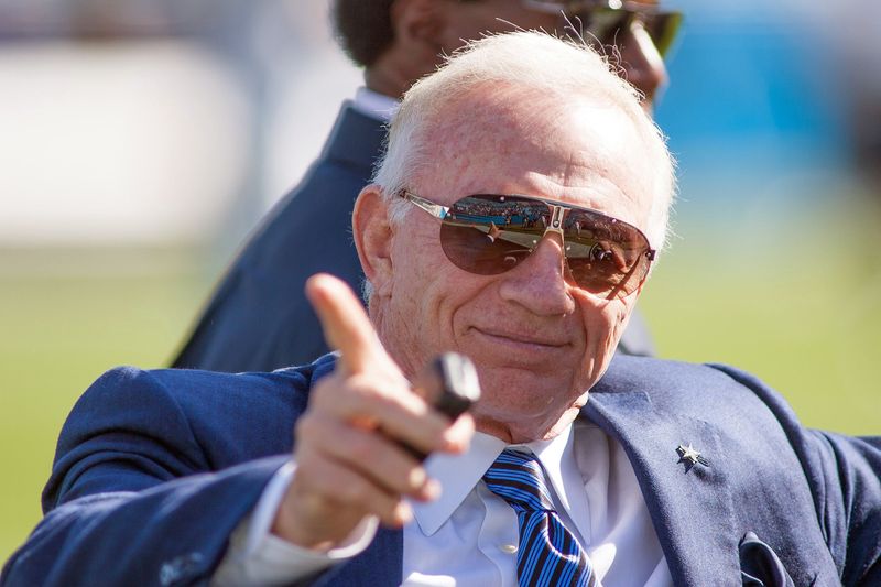 Dallas Cowboys owner Jerry Jones point to the fans prior to the Oct. 21, 2012, game against the Carolina Panthers at Bank of America Stadium.