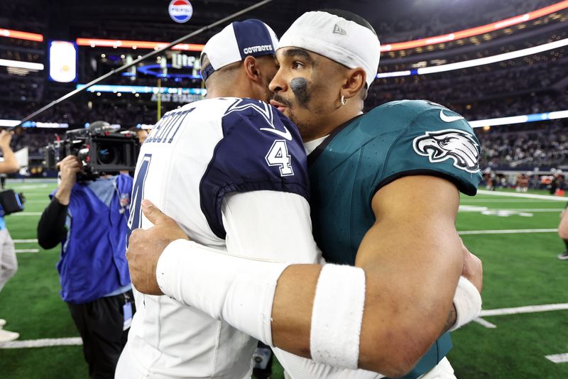 Dec 10, 2023; Arlington, Texas, USA; Dallas Cowboys quarterback Dak Prescott (4) hugs Philadelphia Eagles quarterback Jalen Hurts (1) after the game at AT&T Stadium. Mandatory Credit: Tim Heitman-USA TODAY Sports