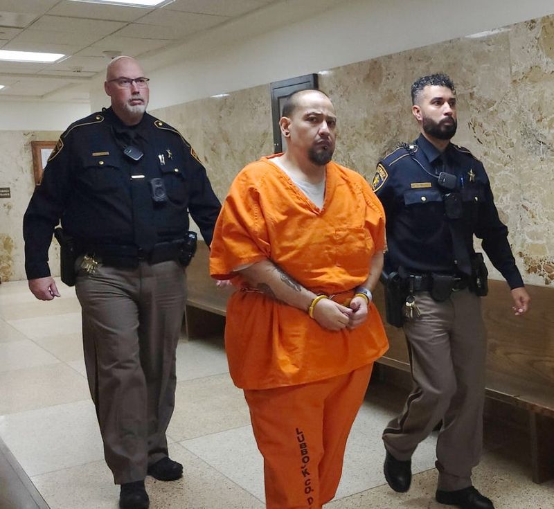 Manuel Garcia is escorted out of the 364th District Court where he was sentenced to 45 years in prison after admitting to abducting at gunpoint 58-year-old Stacey Lynn Williams whose body was found along Texas 137 six miles south of Brownfield.