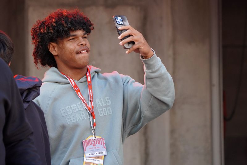 Recruit Jonah Williams watches Ohio State warm up before playing Penn State Oct. 21, 2023 at Ohio Stadium.