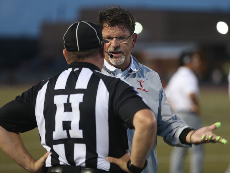 Ray coach Craig Charlton seeks clarification from an official during a non-district high school football game at Buccaneer Stadium on Friday, Sept. 5, 2025.
