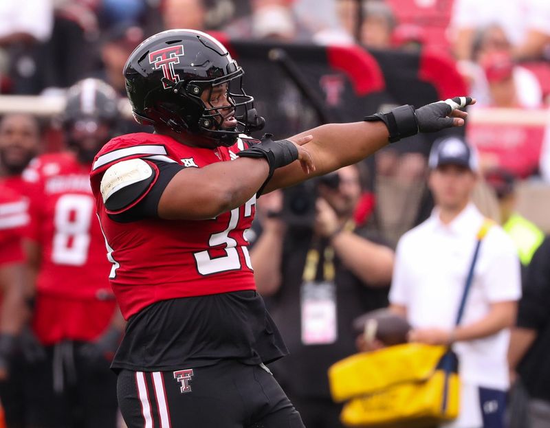 Texas Tech's A.J. Holmes Jr. gestures to the crowd against Kent State during a non-conference football game, Saturday, September 6, 2025, at Jones AT&T Stadium.