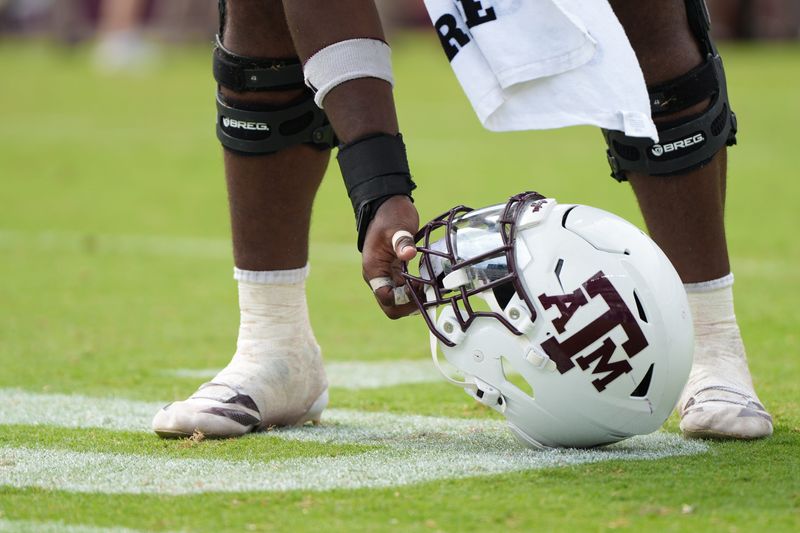 Sep 6, 2025; College Station, Texas, USA; Texas A&M Aggies helmet picked up during the second half against the Utah State Aggies at Kyle Field. Mandatory Credit: Sean Thomas-Imagn Images