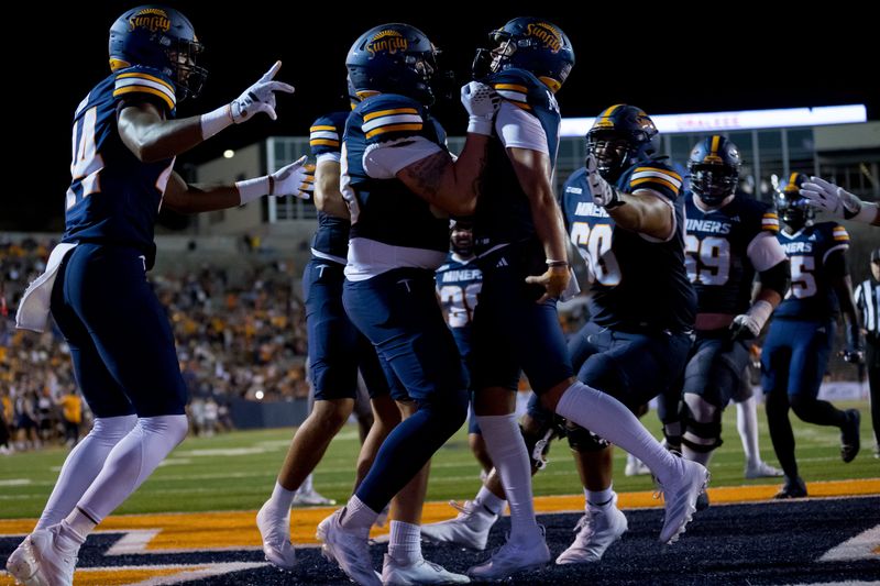 UTEP’s Cade McConnell’s (11) touchdown is celebrated during the Miners’ home opener against UT Martin at the Sun Bowl in El Paso on Saturday, Sept. 6.