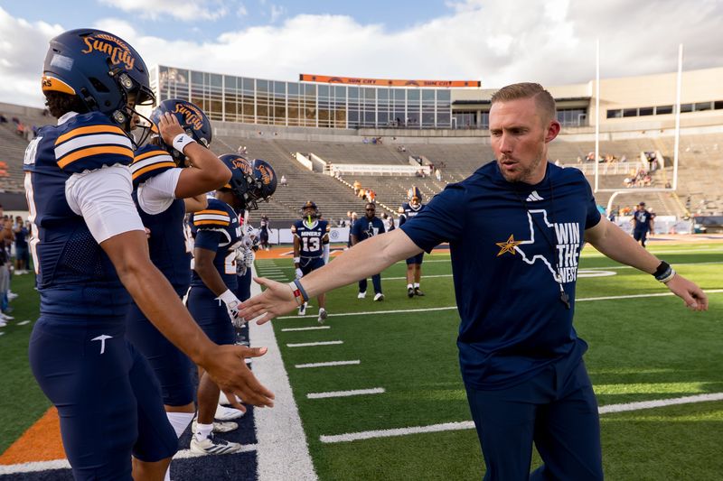 UTEP head football coach Scotty Walden high-fives players before warm-ups ahead of the Miners' 2025 home opener against UT Martin at the Sun Bowl in El Paso on Saturday, Sept. 6.