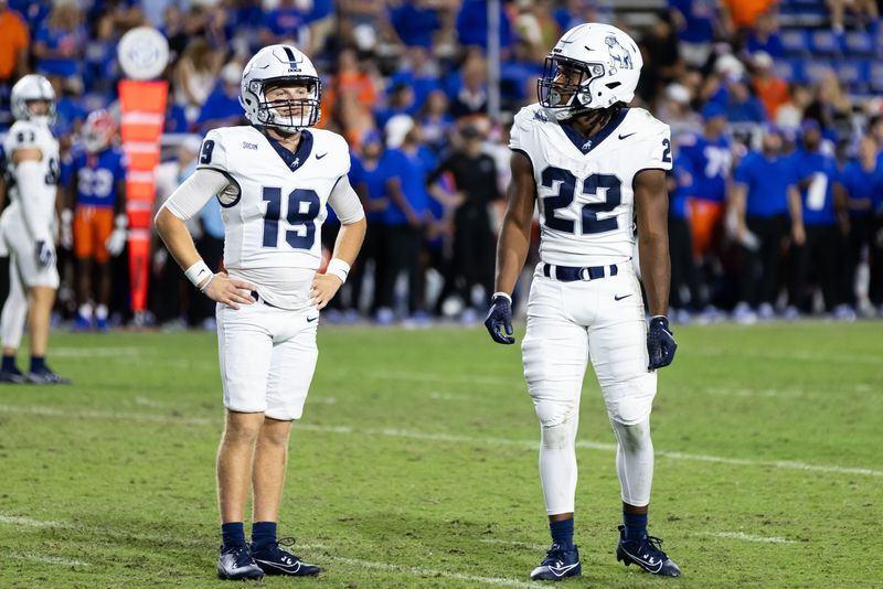 Sep 7, 2024; Gainesville, Florida, USA; Samford Bulldogs quarterback Connor Masters (19) and Samford Bulldogs running back Ken Cherry (22) wait for a play call against the Gators during the second half at Ben Hill Griffin Stadium.