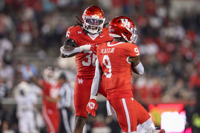 Sep 12, 2025; Houston, Texas, USA; Houston Cougars linebacker Jalen Garner (36) celebrates with linebacker Corey Platt Jr. (9) after a play during the fourth quarter against the Colorado Buffaloes at TDECU Stadium. Mandatory Credit: Troy Taormina-Imagn Images