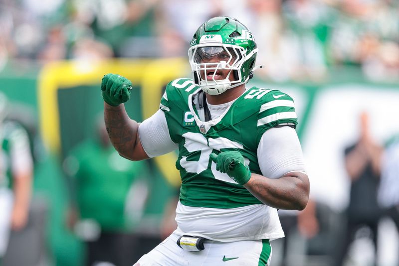 Sep 7, 2025; East Rutherford, New Jersey, USA; New York Jets defensive tackle Quinnen Williams (95) celebrates after a defensive stop during the game against the Pittsburgh Steelers at MetLife Stadium. Mandatory Credit: Vincent Carchietta-Imagn Images