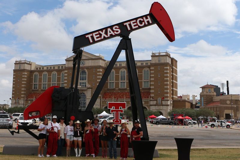 Sep 13, 2025; Lubbock, Texas, USA; Texas Tech Red Raiders fans gather in front of the new pump jack outside Jones AT&T Stadium before the game between the Oregon State Beavers and the Texas Tech Red Raiders. Mandatory Credit: Michael C. Johnson-Imagn Images