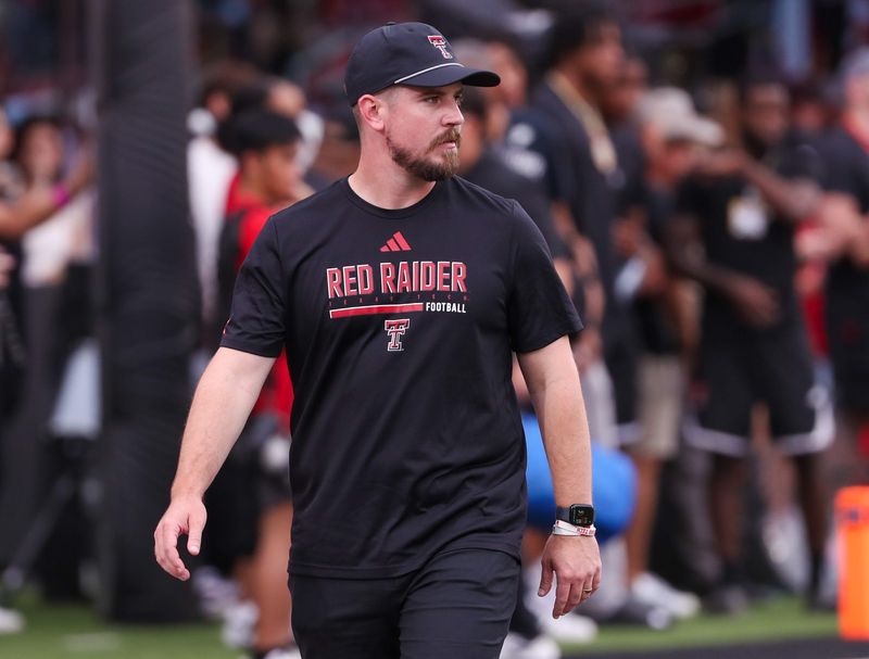 Texas Tech offensive coordinator Mack Leftwich walks the field prior to a non-conference football game, Saturday, Sept. 13, 2025, at Jones AT&T Stadium.