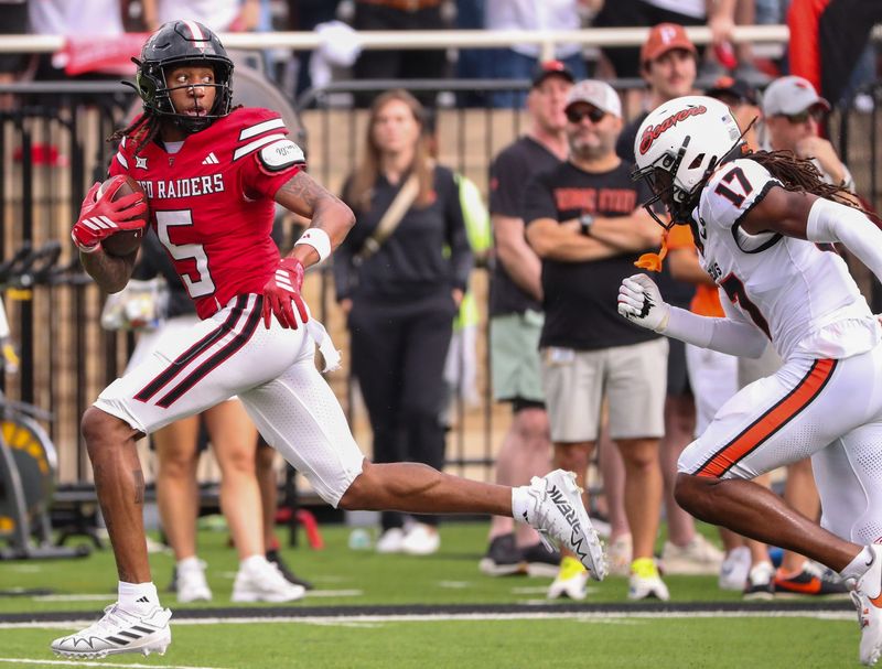 Texas Tech's Caleb Douglas looks back before scoring a touchdown against Oregon State during a non-conference football game, Saturday, Sept. 13, 2025, at Jones AT&T Stadium.