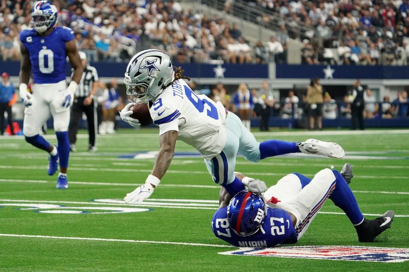 Sep 14, 2025; Arlington, Texas, USA; New York Giants safety Tyler Nubin (27) tackles Dallas Cowboys wide receiver KaVontae Turpin (9) during the second quarter at AT&T Stadium. Mandatory Credit: Raymond Carlin III-Imagn Images