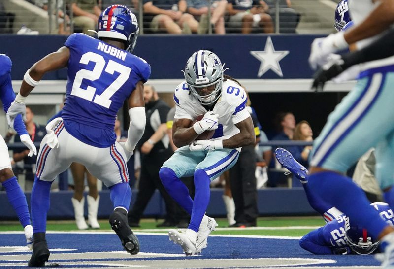 Sep 14, 2025; Arlington, Texas, USA; Dallas Cowboys wide receiver KaVontae Turpin (9) makes a catch for a touchdown against the New York Giants during the second quarter at AT&T Stadium. Mandatory Credit: Raymond Carlin III-Imagn Images