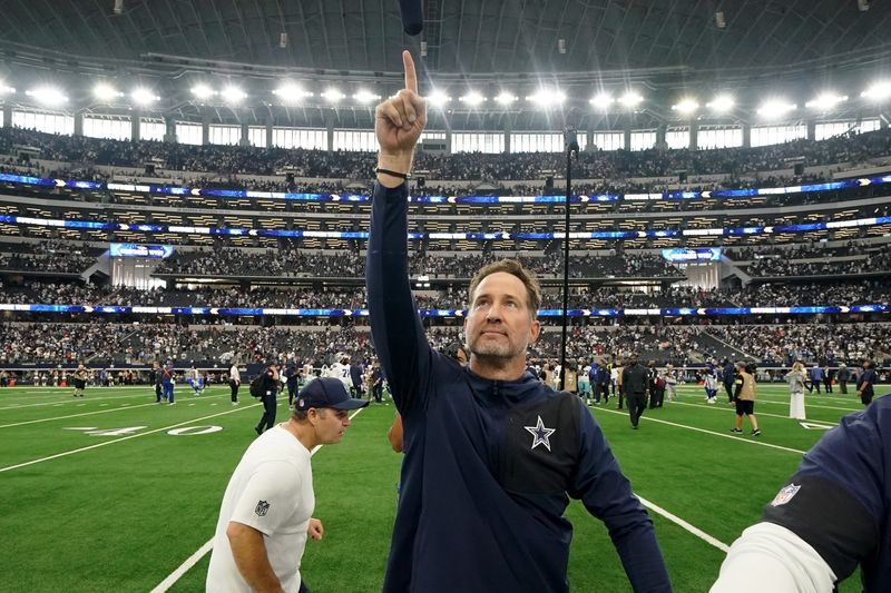 Sep 14, 2025; Arlington, Texas, USA; Dallas Cowboys head coach Brian Schottenheimer gestures to fans after the game against the New York Giants at AT&T Stadium. Mandatory Credit: Raymond Carlin III-Imagn Images