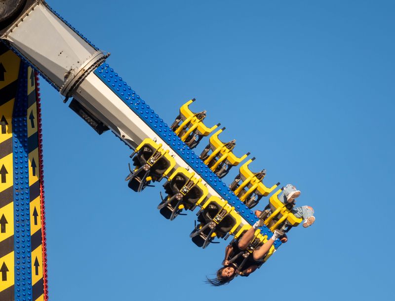 Fairgoers hang upside down on a thrill ride at the Tri-State Fair & Rodeo in Amarillo, delivering a heart-pounding rush high above the midway.