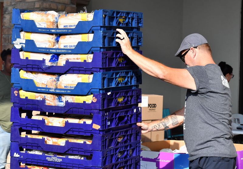 Food insecurity is on the rise in North Texas. Nathan Barbin, a member of Legacy Church of God, moves pallets of bread during the Wichita Falls Area Food Bank mobile pantry on Sep. 16, 2025. Navy Sailors also volunteered as part of an outreach program for Navy Week in Wichita Falls.
