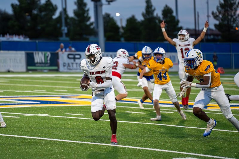 Wellington's Kamron Brooks (8) catches a pass from teammate Callen Kane (12) and speeds past Lubbock Christian defenders during a non-district game Friday, Sept. 19, 2025 at Masked Rider Capital Field in Lubbock, Texas.