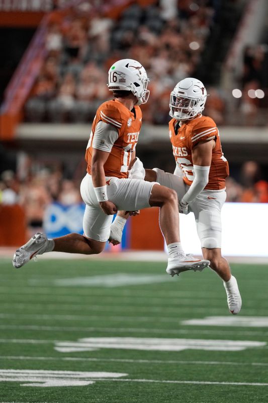 Sep 20, 2025; Austin, Texas, USA; Texas Longhorns quarterback Arch Manning (16) and defensive back Michael Taaffe (16) celebrate after Manning ran for a touchdown during the first half against the Sam Houston Bearkats at Darrell K Royal-Texas Memorial Stadium. Mandatory Credit: Scott Wachter-Imagn Images