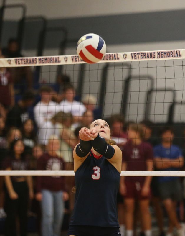 Veterans Memorial's Parker Malone sends a ball over the net during a high school volleyball match against Flour Bluff on Tuesday, Sept. 23, 2025 at Veterans Memorial High School.