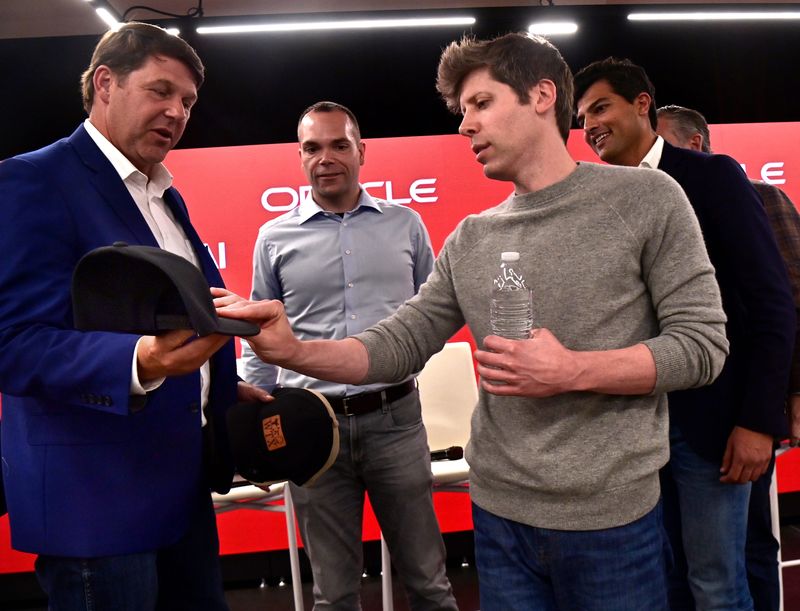 OpenAI CEO Sam Altman admires the leather patch on a West Texas-themed ball cap presented to him by U.S. Rep. Jodey Arrington, R-Lubbock, Tuesday. Altman and others hosted a tour of the Stargate data center under construction in north Abilene.