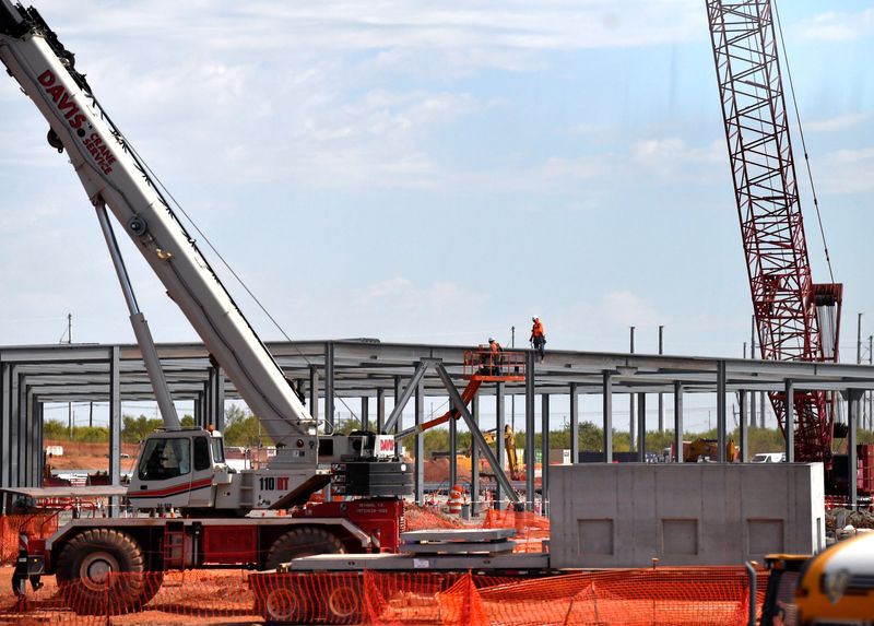 Iron workers labor on the skeleton of one of the Stargate data center buildings in north Abilene Tuesday Sept. 23, 2025. The 1,100 acre facility is scheduled for completion in mid-2026.