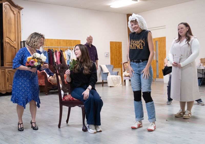 Cast members rehearse a playful scene with flowers and costumes for Amarillo Opera’s production of Mozart’s “The Marriage of Figaro” at the Globe-News Center on Sept. 29, 2025.