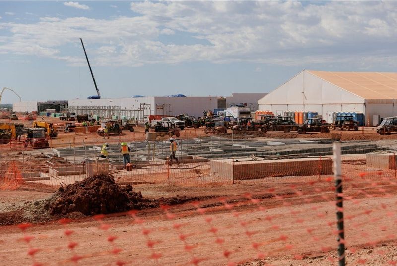 Data center buildings under construction at the OpenAI data center in Abilene on Sept. 23, 2025.