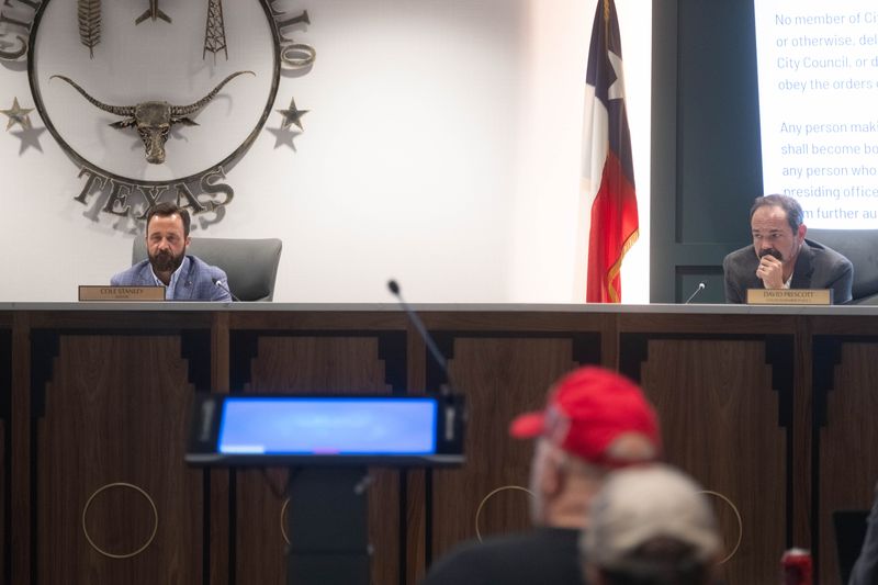 Mayor Cole Stanley, left, and Councilmember David Prescott listen during public comment at the Amarillo City Council meeting on Sept. 23, 2025.