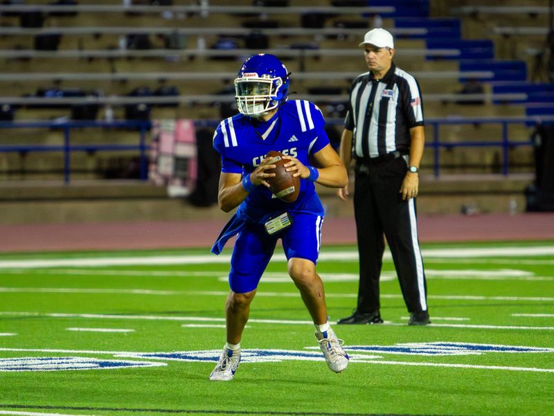 Lake View football's Chris Alvizo (7) rolls out and looks to throw against Levelland at San Angelo Stadium on Friday, Sept. 26, 2025.