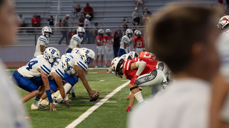 The Stratford Elks and Trinity Christian Lions line up at the line of scrimmage during a non-district game on Friday, September 26, 2025 at Archie Warwick Stadium in Lubbock, Texas.