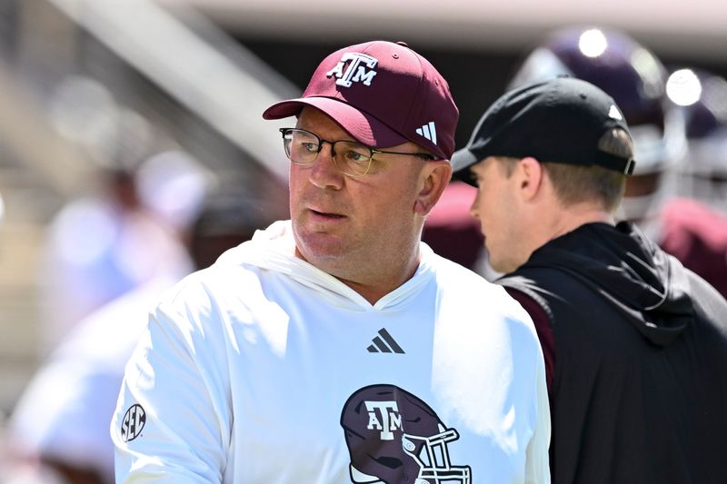 Sep 27, 2025; College Station, Texas, USA; Texas A&M Aggies head coach Mike Elko walks on the field prior to the game against the Auburn Tigers at Kyle Field. Mandatory Credit: Maria Lysaker-Imagn Images