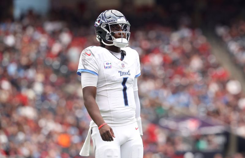 Sep 28, 2025; Houston, Texas, USA; Tennessee Titans quarterback Cam Ward (1) during the first half against the Houston Texans at NRG Stadium. Mandatory Credit: Troy Taormina-Imagn Images