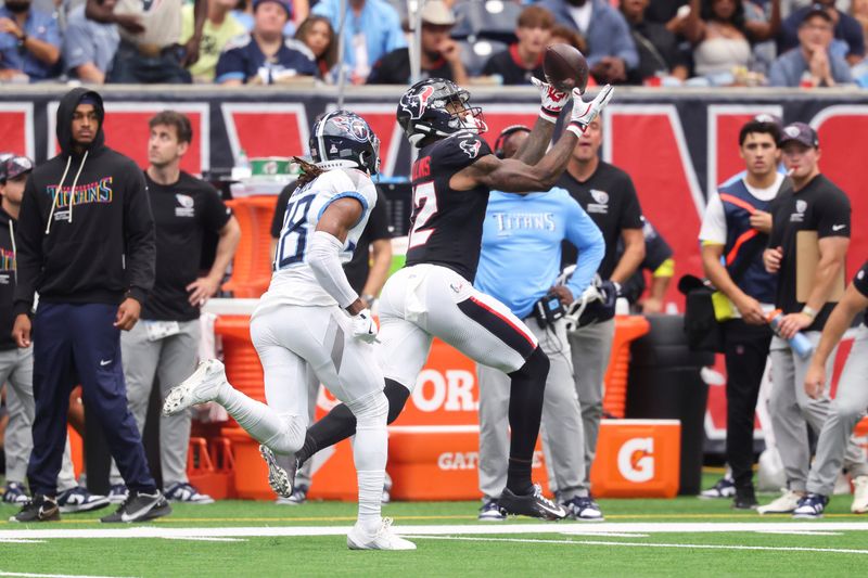 Sep 28, 2025; Houston, Texas, USA; Houston Texans wide receiver Nico Collins (12) makes a reception as Tennessee Titans cornerback L'Jarius Sneed (38) defends during the third quarter at NRG Stadium. Mandatory Credit: Troy Taormina-Imagn Images