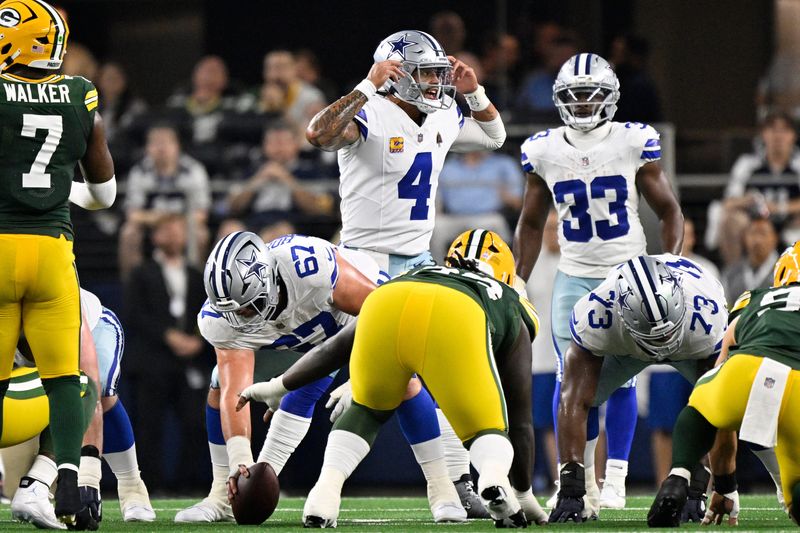 Sep 28, 2025; Arlington, Texas, USA; Dallas Cowboys quarterback Dak Prescott (4) calls a play in the first half against the Green Bay Packers at AT&T Stadium. Mandatory Credit: Jerome Miron-Imagn Images