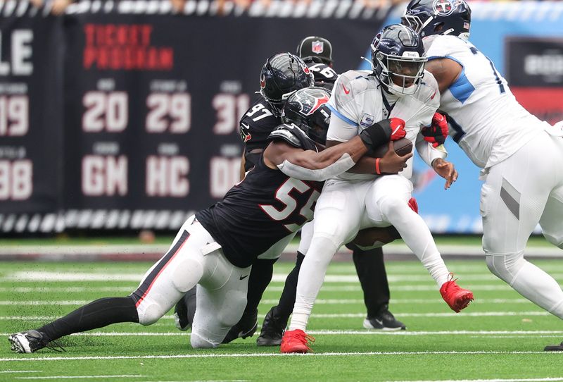 Sep 28, 2025; Houston, Texas, USA; Houston Texans defensive end Danielle Hunter (55) sacks Tennessee Titans quarterback Cam Ward (1) during the first half at NRG Stadium. Mandatory Credit: Troy Taormina-Imagn Images
