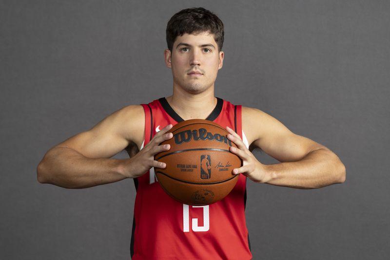 Sep 29, 2025; Houston, TX, USA; Houston Rockets guard Reed Sheppard (15) poses for a picture during Houston Rockets media day at Toyota Center. Mandatory Credit: Troy Taormina-Imagn Images