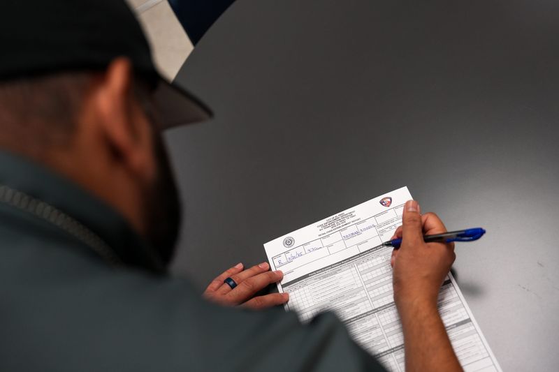 Anthony Morales, sanitary services manager for the City of El Paso, prepares a report from an inspection of a local restaurant.