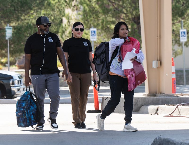 Far right) Catalina "Xóchitl" Santiago, an immigration advocate and a Deferred Action for Childhood Arrivals (DACA) recipient, was released from an ICE Detention Center shortly after 5 p.m. Wednesday, Oct. 1. She was escorted out of the premises by two ICE agents.