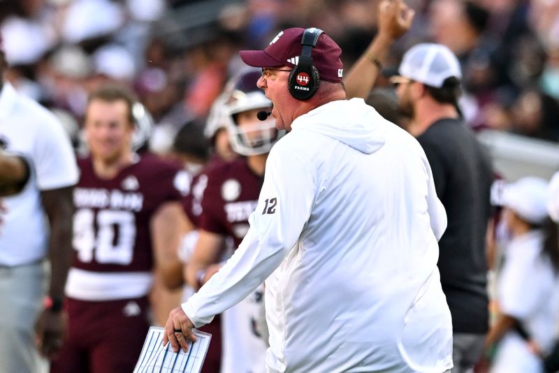 Sep 27, 2025; College Station, Texas, USA; Texas A&M Aggies head coach Mike Elko reacts against the Auburn Tigers during the fourth quarter at Kyle Field. Mandatory Credit: Maria Lysaker-Imagn Images