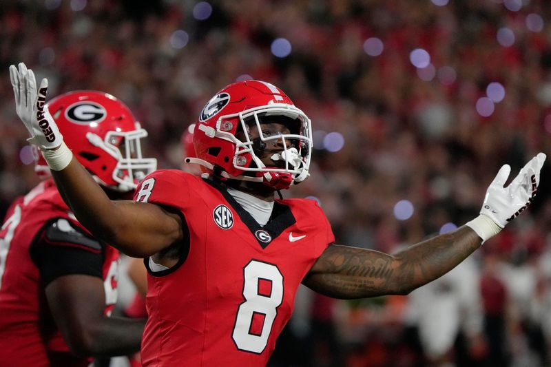 Georgia Bulldogs wide receiver Colbie Young (8) celebrates after scoring a touchdown during the first half of a NCAA college football game against Alabama in Athens, Ga., on Saturday, September 27, 2025.