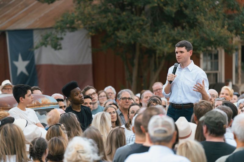 Texas Rep. James Talarico speaks to a crowd of supporters.