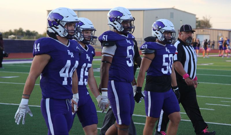 River Road captains Josh Fjetland (44), Josh Henderson (15), Rylan Mayfield (51) and Braxton Perkins (50) walk onto the field for the coin toss before a non-district football game against Gruver at Wildcat Stadium on Oct. 3, 2025.