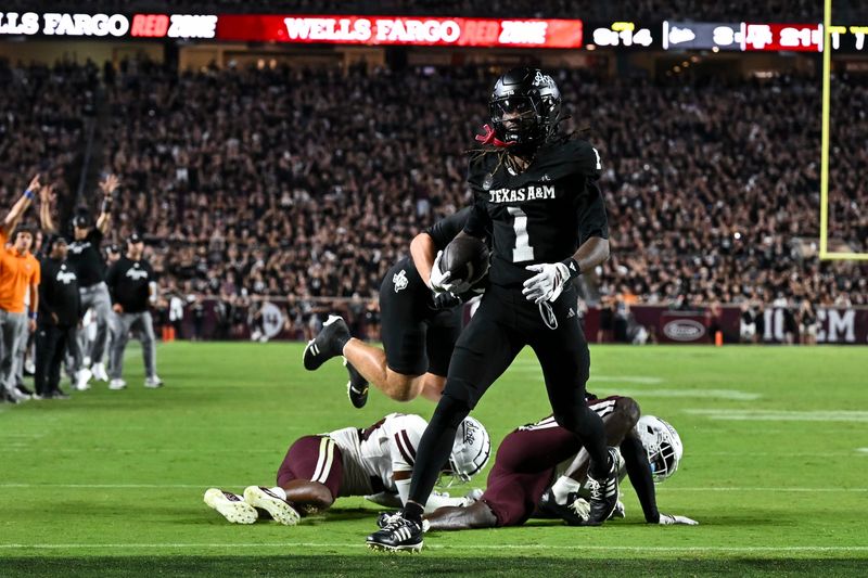 Oct 4, 2025; College Station, Texas, USA; Texas A&M Aggies wide receiver Mario Craver (1) runs the ball in for a touchdown during the fourth quarter against the Mississippi State Bulldogs at Kyle Field. Mandatory Credit: Maria Lysaker-Imagn Images