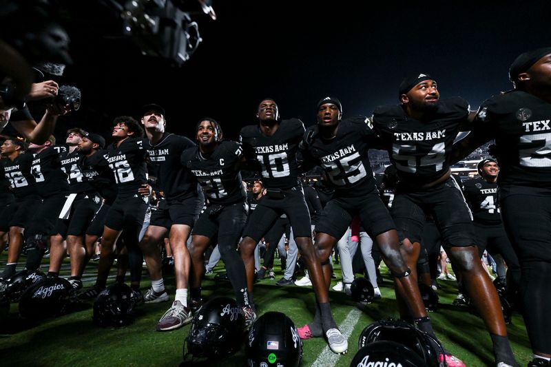 Oct 4, 2025; College Station, Texas, USA; Texas A&M Aggies quarterback Marcel Reed (10) and teammates celebrate after the win over the Mississippi State Bulldogs at Kyle Field. Mandatory Credit: Maria Lysaker-Imagn Images