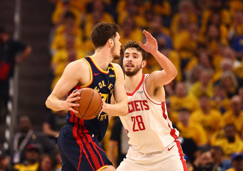 Apr 28, 2025; San Francisco, California, USA; Houston Rockets center Alperen Sengun (28) defends Golden State Warriors center Quinten Post (21) during the first quarter of game four of the 2025 NBA Playoffs first round at Chase Center. Mandatory Credit: Kelley L Cox-Imagn Images