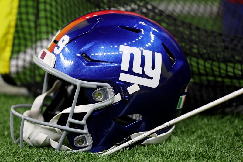 Oct 5, 2025; New Orleans, Louisiana, USA; A detail view of a New York Giants helmet on the sideline during the first half at Caesars Superdome. Mandatory Credit: Stephen Lew-Imagn Images