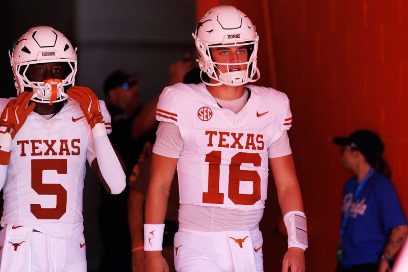 Oct 4, 2025; Gainesville, Florida, USA; Texas Longhorns quarterback Arch Manning (16) walks out of the tunnel with Texas Longhorns running back Quintrevion Wisner (5) before a game against the Florida Gators at Ben Hill Griffin Stadium. Mandatory Credit: Matt Pendleton-Imagn Images