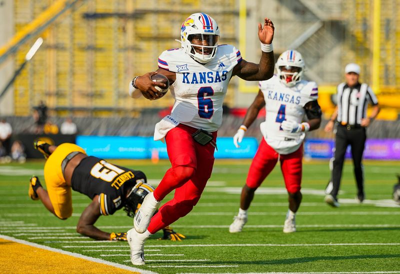Sep 6, 2025; Columbia, Missouri, USA; Kansas Jayhawks quarterback Jalon Daniels (6) runs the ball during the second half against the Missouri Tigers at Faurot Field at Memorial Stadium. Mandatory Credit: Jay Biggerstaff-Imagn Images