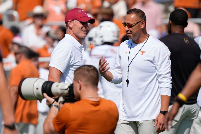 Oklahoma coach Brent Venables talks with Texas coach Steve Sarkisian before the Red River Rivalry college football game between the University of Oklahoma Sooners (OU) and the Texas Longhorns at the Cotton Bowl in Dallas, Saturday, Oct. 12, 2024.